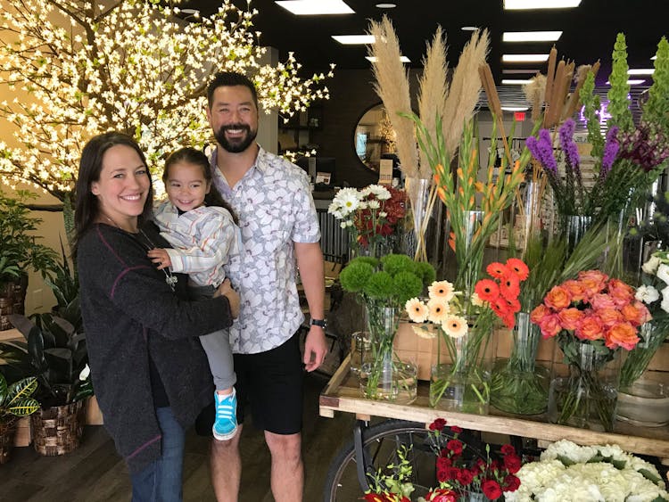 On grand opening day, the Guenther family smiles inside their brand new showroom